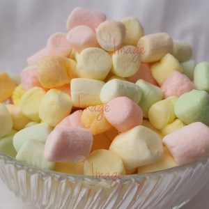 A Glass Bowl Of Bright Colored Marshmallows