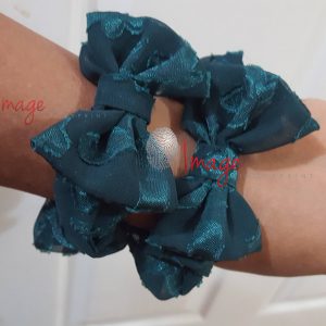 Hand with green hair accessories Green Fabric Bow Wrist Accessories – Handmade Lifestyle Photo
